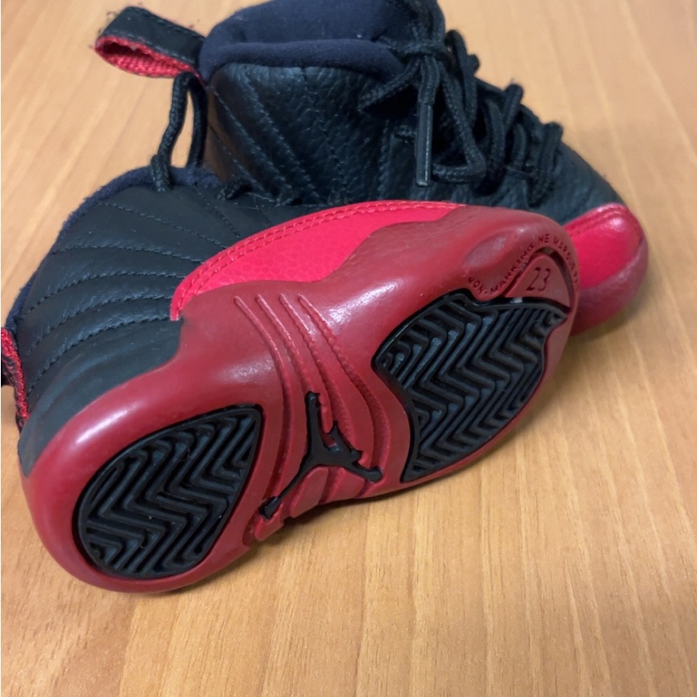 Sleek Black and Red Athletic Sneakers with Geometric Outsole size 3c $45